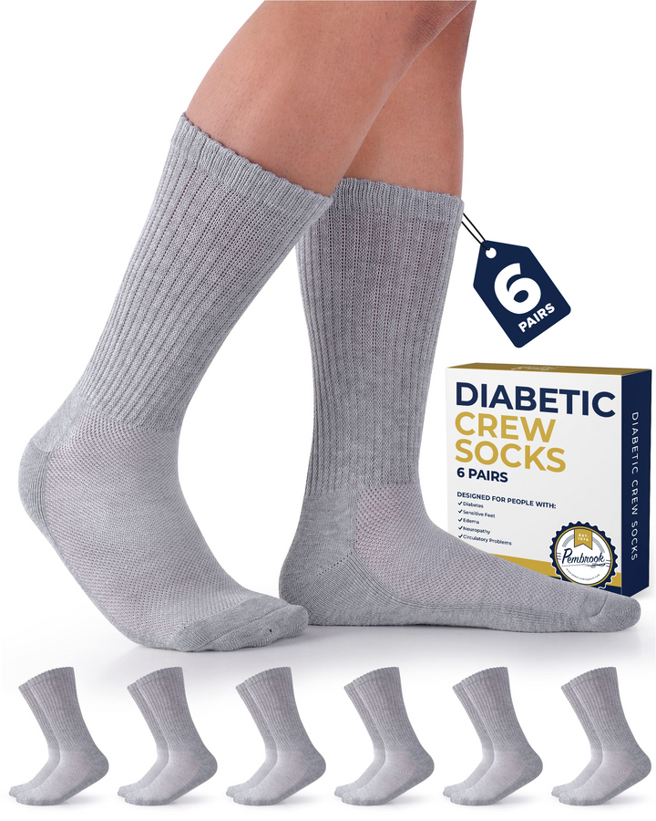 Gray diabetic crew socks with packaging and additional socks displayed on a white background