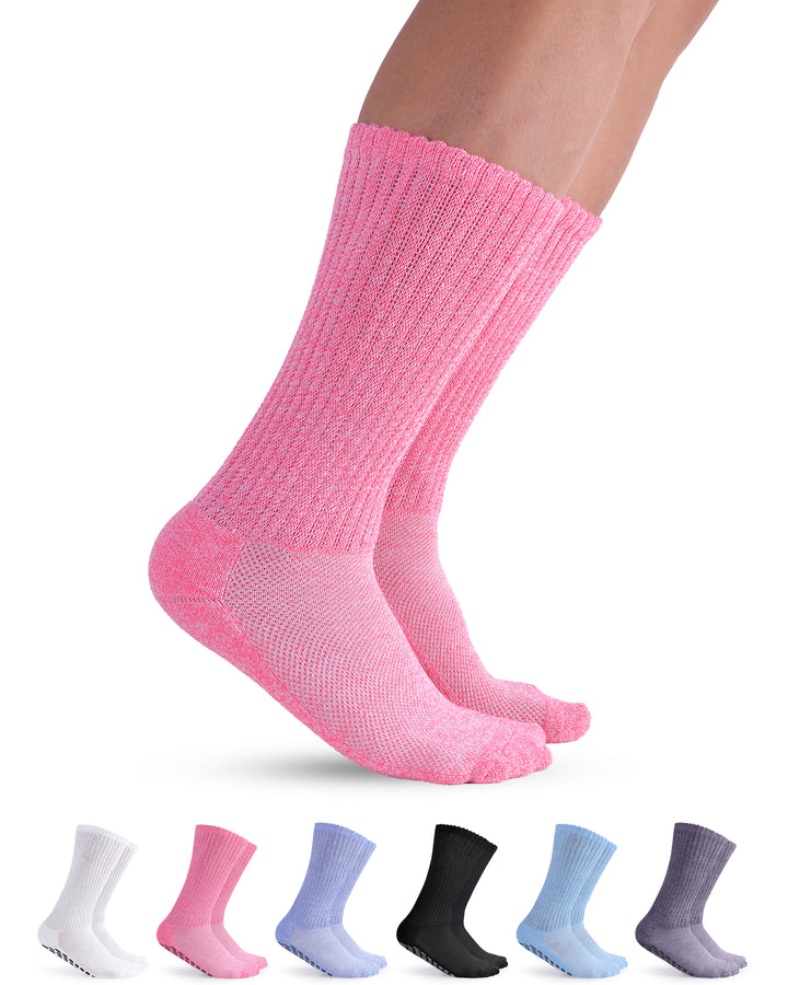 Pink socks being worn with a set of six pairs in various colors on a white background.