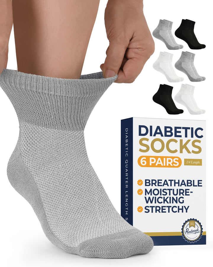 Gray diabetic sock being worn with a box of 6 pairs of diabetic socks in the background.