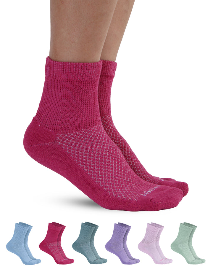 Pink socks with fishnet pattern worn by a person, with six additional pairs of socks displayed below on a white background.