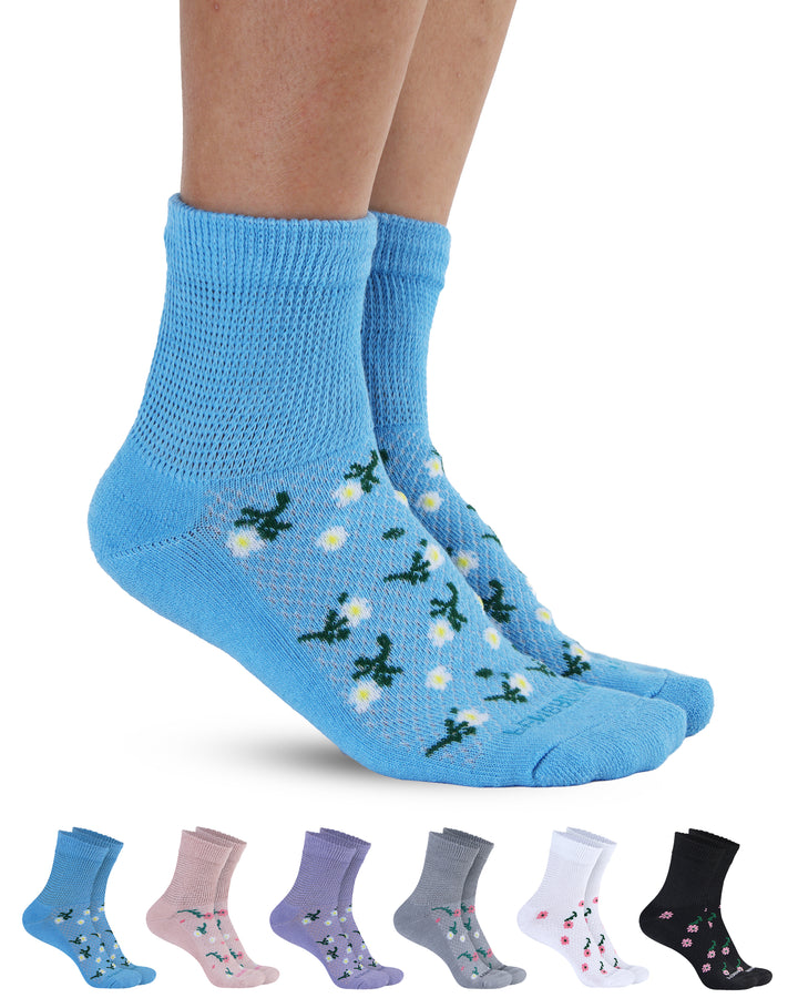 Blue socks with floral pattern worn by a person, with six pairs of similar socks displayed below on a white background.